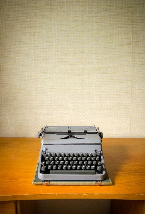 typewriter on wooden desk