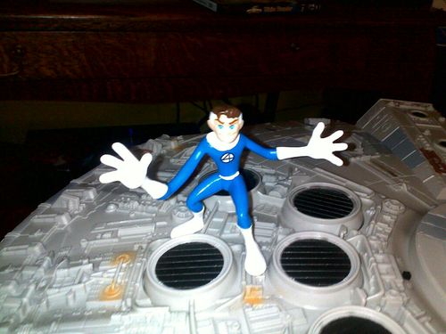 Nothing says Merry Christmas like Mr Fantastic doing jazz hands on top of the Millenium Falcoln.