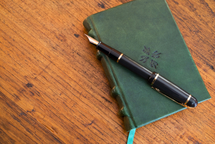 leather journal on desk